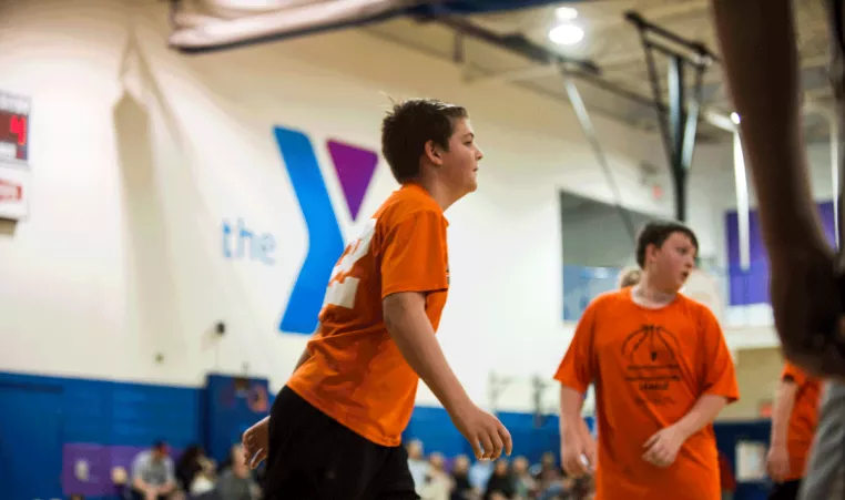 Youth Sports - A teen basketball game at the kennett area ymca in kennett square. 