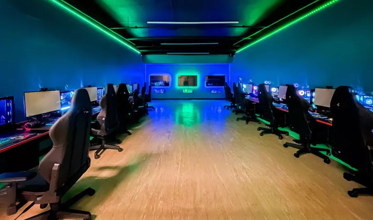 The esports room at the Oscar Lasko YMCA in West Chester is shown with computers, chairs and decorative lighting