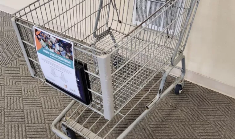 A grocery cart is shown which is setup for food donations benefitting the Chester County food bank
