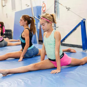Members of the Gymcats YMCA Gymnastics Team in West Chester warm up before their weekly gymnastics classes.