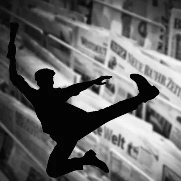 Newsies Theater Logo with Newspapers in Background