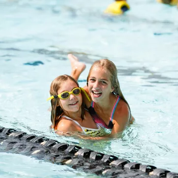 Kids making friends during free swim time at Brandywine YMCA Summer Camp