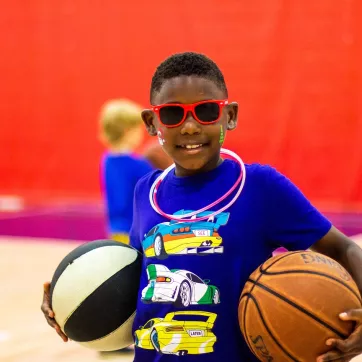 Summer Camper Playing Basketball